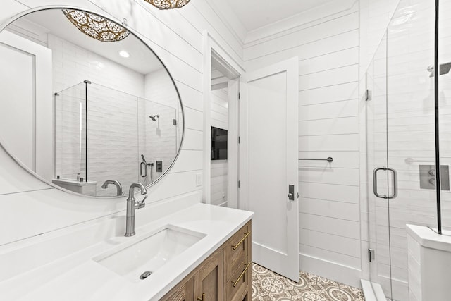 bathroom featuring a stall shower and vanity