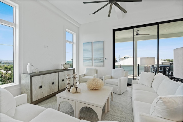 living area featuring a ceiling fan