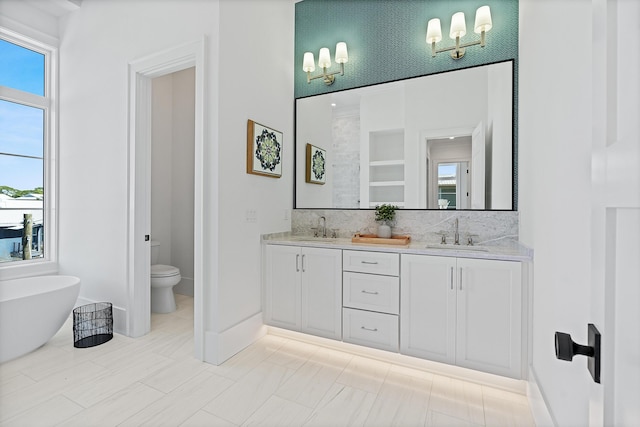 bathroom featuring a sink and a wealth of natural light