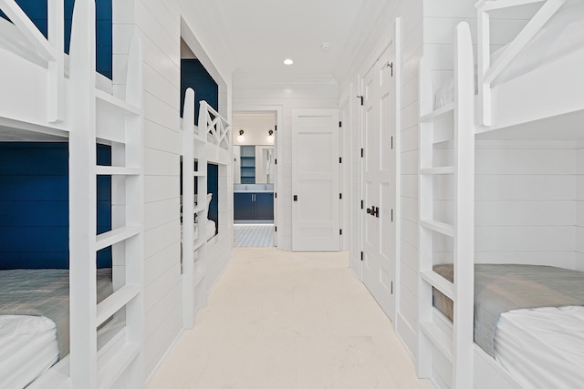 hall featuring recessed lighting and ornamental molding