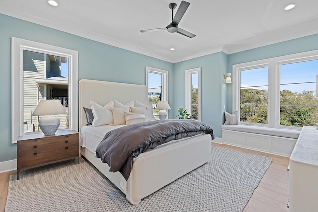 bedroom featuring recessed lighting, baseboards, crown molding, and light wood-style floors