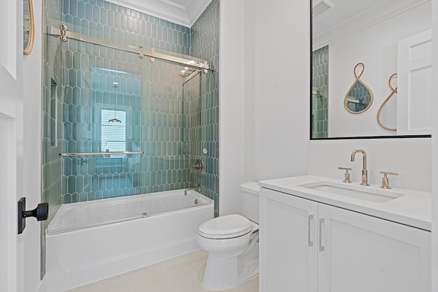 bathroom featuring vanity, toilet, ornamental molding, and bath / shower combo with glass door