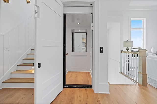 interior space with stairway and light wood-type flooring