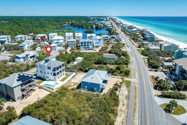 bird's eye view with a beach view and a water view