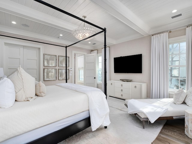 bedroom featuring visible vents, beam ceiling, wood finished floors, recessed lighting, and wood ceiling