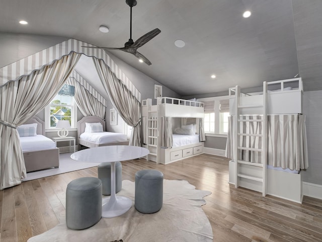 bedroom featuring recessed lighting, baseboards, wood finished floors, and vaulted ceiling