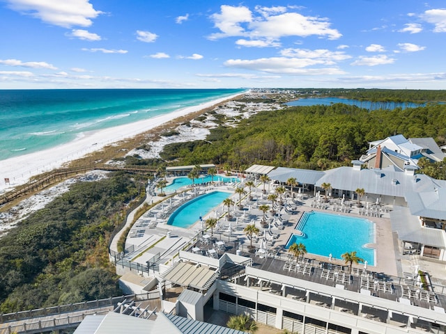 bird's eye view featuring a water view and a beach view