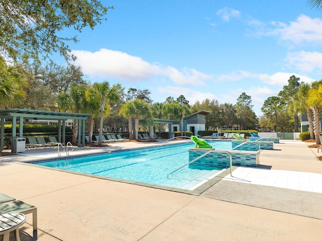 pool with a patio and a pergola