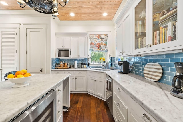 kitchen with light stone counters, wooden ceiling, dark wood-style floors, white cabinets, and stainless steel dishwasher