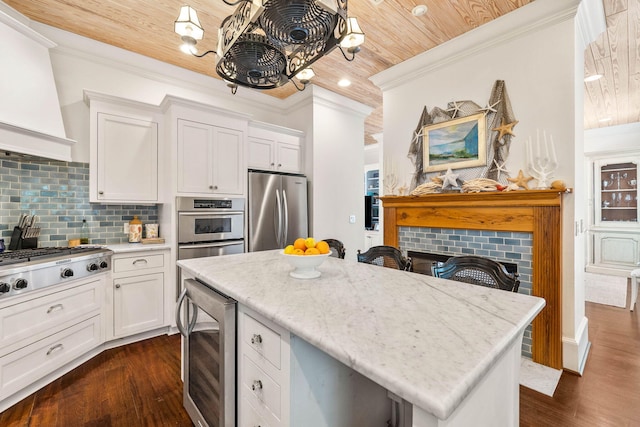 kitchen featuring wine cooler, appliances with stainless steel finishes, wood ceiling, and a brick fireplace