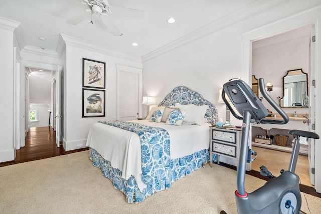 carpeted bedroom featuring a ceiling fan, recessed lighting, baseboards, and ornamental molding