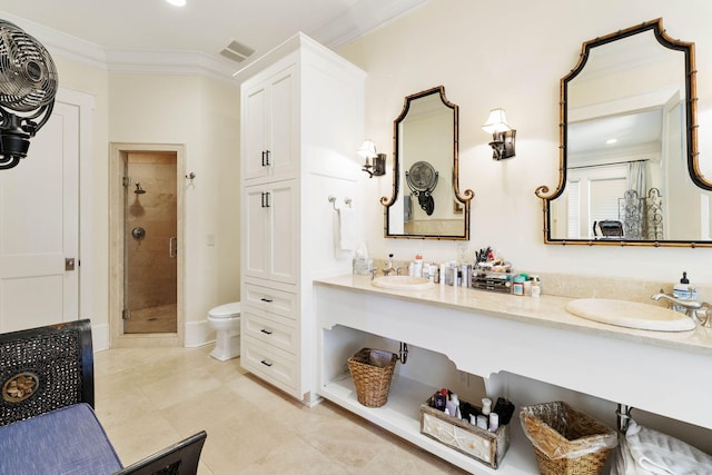 bathroom featuring visible vents, toilet, a stall shower, ornamental molding, and double vanity