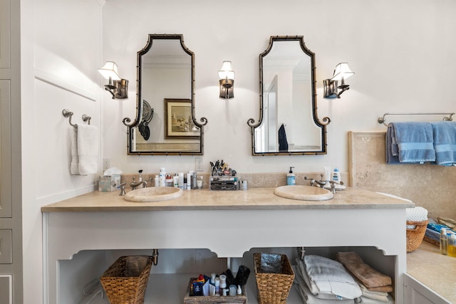 bathroom with a sink and double vanity