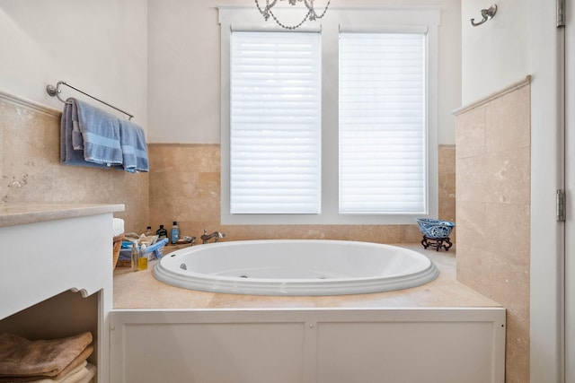 full bathroom featuring a tub with jets