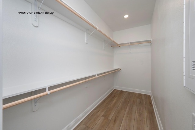 spacious closet with wood finished floors