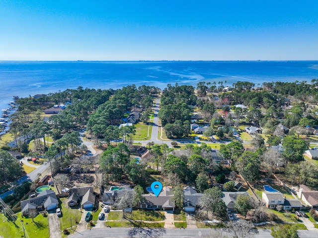 drone / aerial view with a water view and a residential view