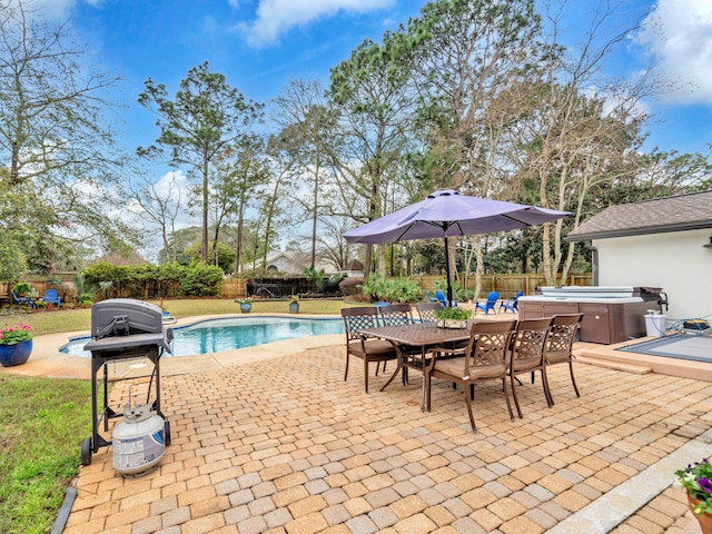 view of pool with a patio, area for grilling, a fenced backyard, and a hot tub