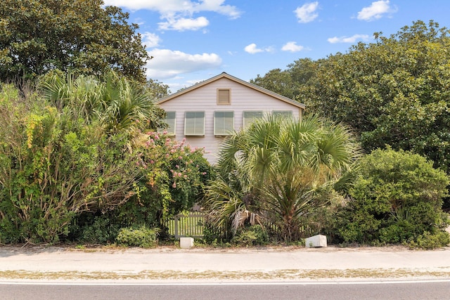 view of side of property with fence