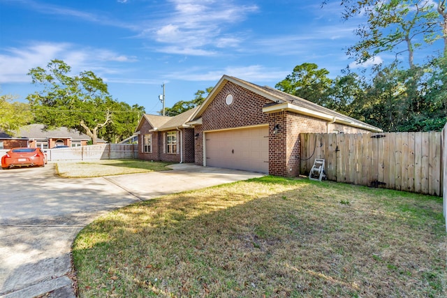 single story home with brick siding, an attached garage, fence, a front yard, and driveway