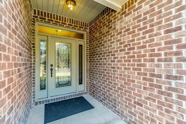 entrance to property with brick siding