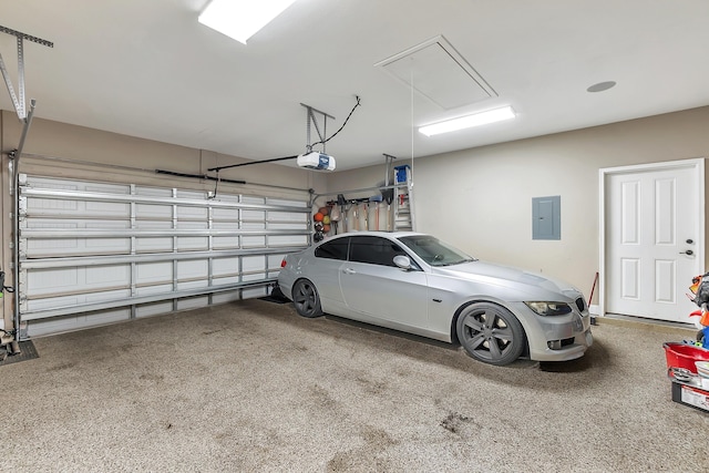 garage featuring electric panel and a garage door opener