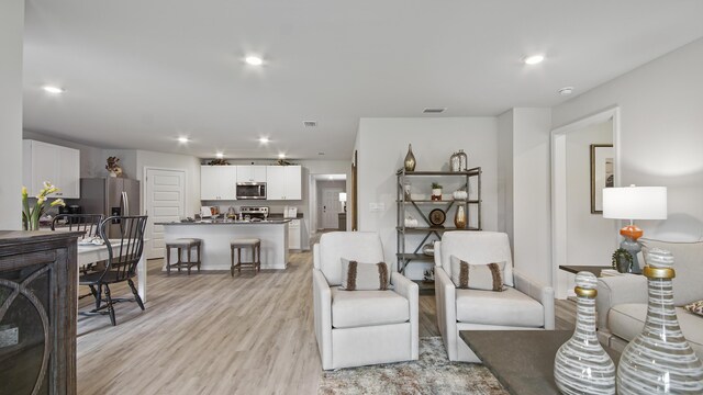 217 Eunola Ln, Freeport, FL 32439 - living room with light wood-style floors, recessed lighting, and visible vents