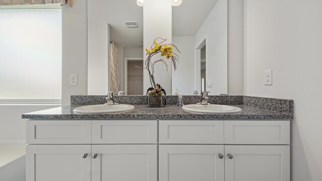 217 Eunola Ln, Freeport, FL 32439 - full bath with double vanity, visible vents, and a sink