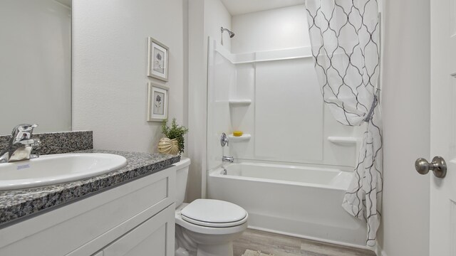 217 Eunola Ln, Freeport, FL 32439 - bathroom with shower / bath combo with shower curtain, wood finished floors, toilet, and vanity