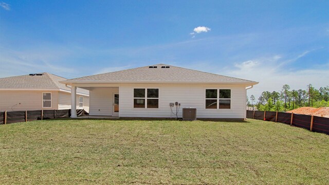 217 Eunola Ln, Freeport, FL 32439 - back of house featuring a yard, central air condition unit, and a fenced backyard