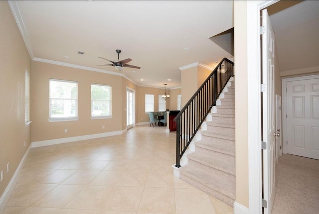 interior space featuring visible vents, baseboards, ornamental molding, tile patterned floors, and ceiling fan with notable chandelier