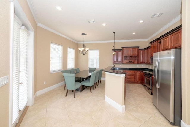 kitchen with crown molding, baseboards, visible vents, and appliances with stainless steel finishes