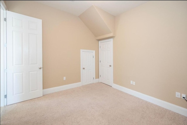 unfurnished bedroom featuring baseboards and carpet