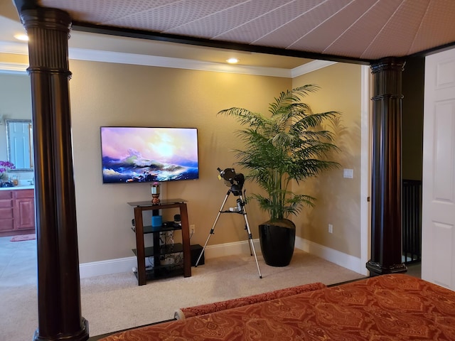 carpeted bedroom featuring baseboards, crown molding, and ornate columns