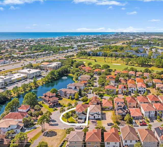 bird's eye view with a residential view and a water view