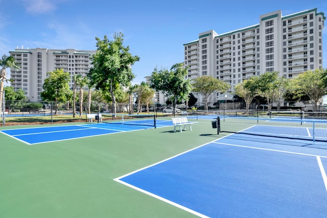 view of sport court featuring fence