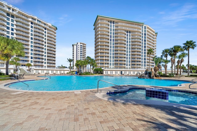 pool featuring a patio area and a hot tub