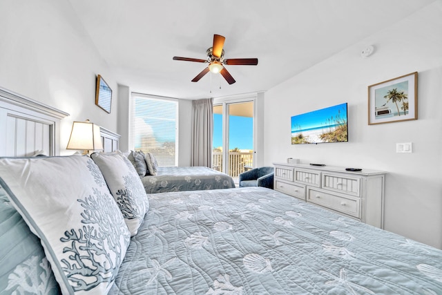 bedroom featuring a ceiling fan and access to outside