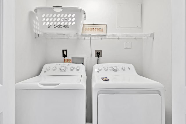 laundry room featuring washer and dryer and laundry area