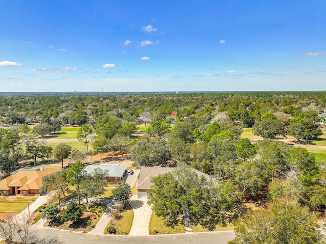 bird's eye view featuring a wooded view