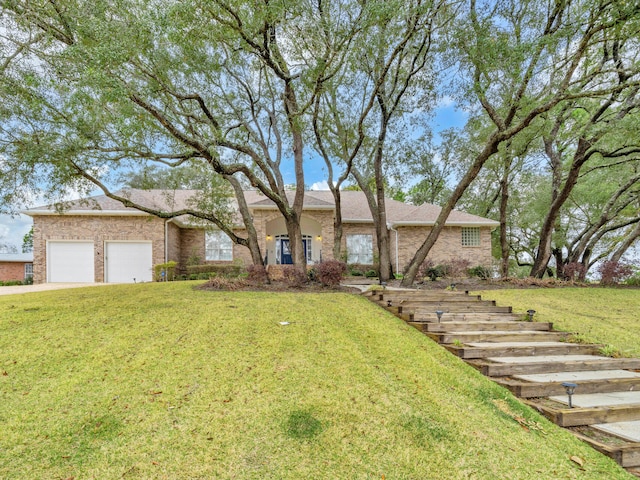 single story home with brick siding, an attached garage, concrete driveway, and a front lawn