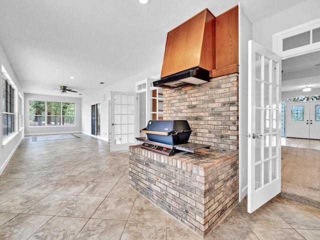 living room featuring light tile patterned flooring, french doors, baseboards, and ceiling fan