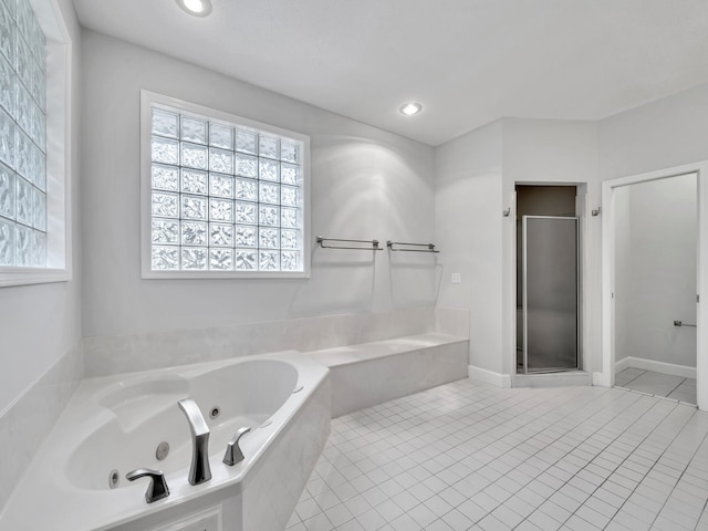 bathroom featuring tile patterned floors, recessed lighting, a stall shower, and a whirlpool tub