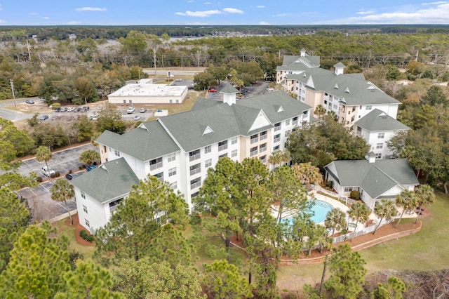 aerial view featuring a wooded view