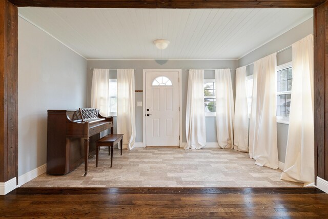 entrance foyer with hardwood / wood-style floors and baseboards