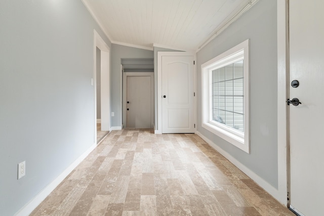 interior space with crown molding and baseboards