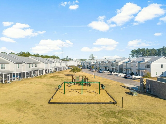 view of home's community with playground community and a residential view