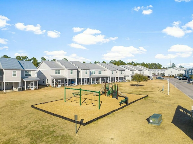 view of property's community with playground community and a residential view