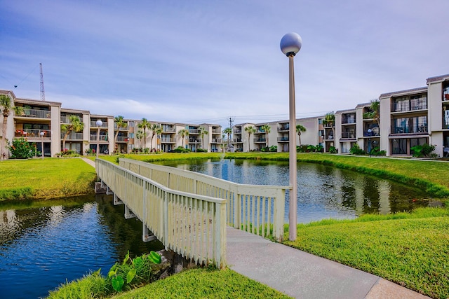 exterior space featuring a yard and a water view