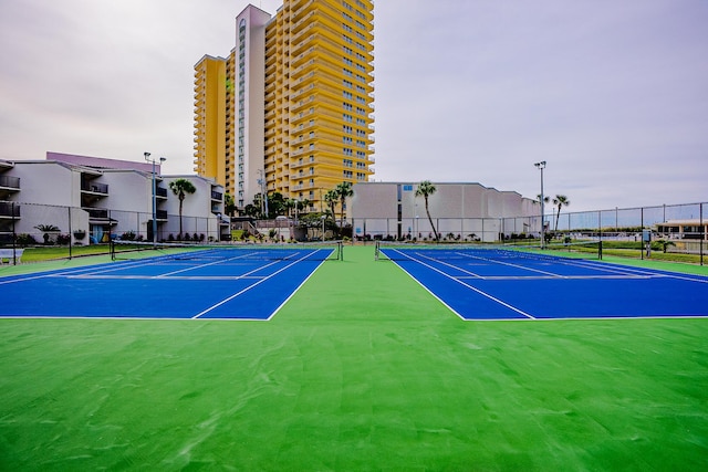 view of sport court featuring community basketball court and fence