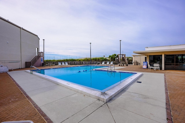 pool with a patio area